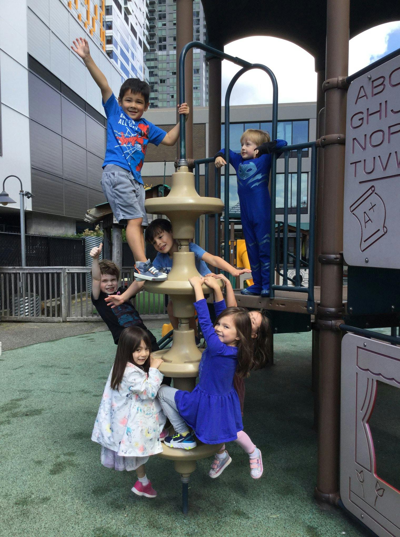 Children playing on a playground structure