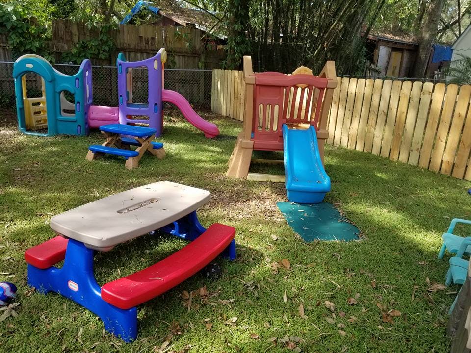 Playground with slides, swings, and a picnic table