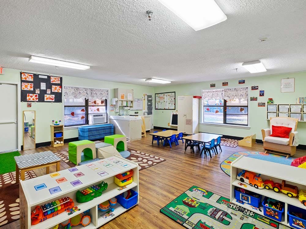 Classroom with children's toys, tables, and activity areas