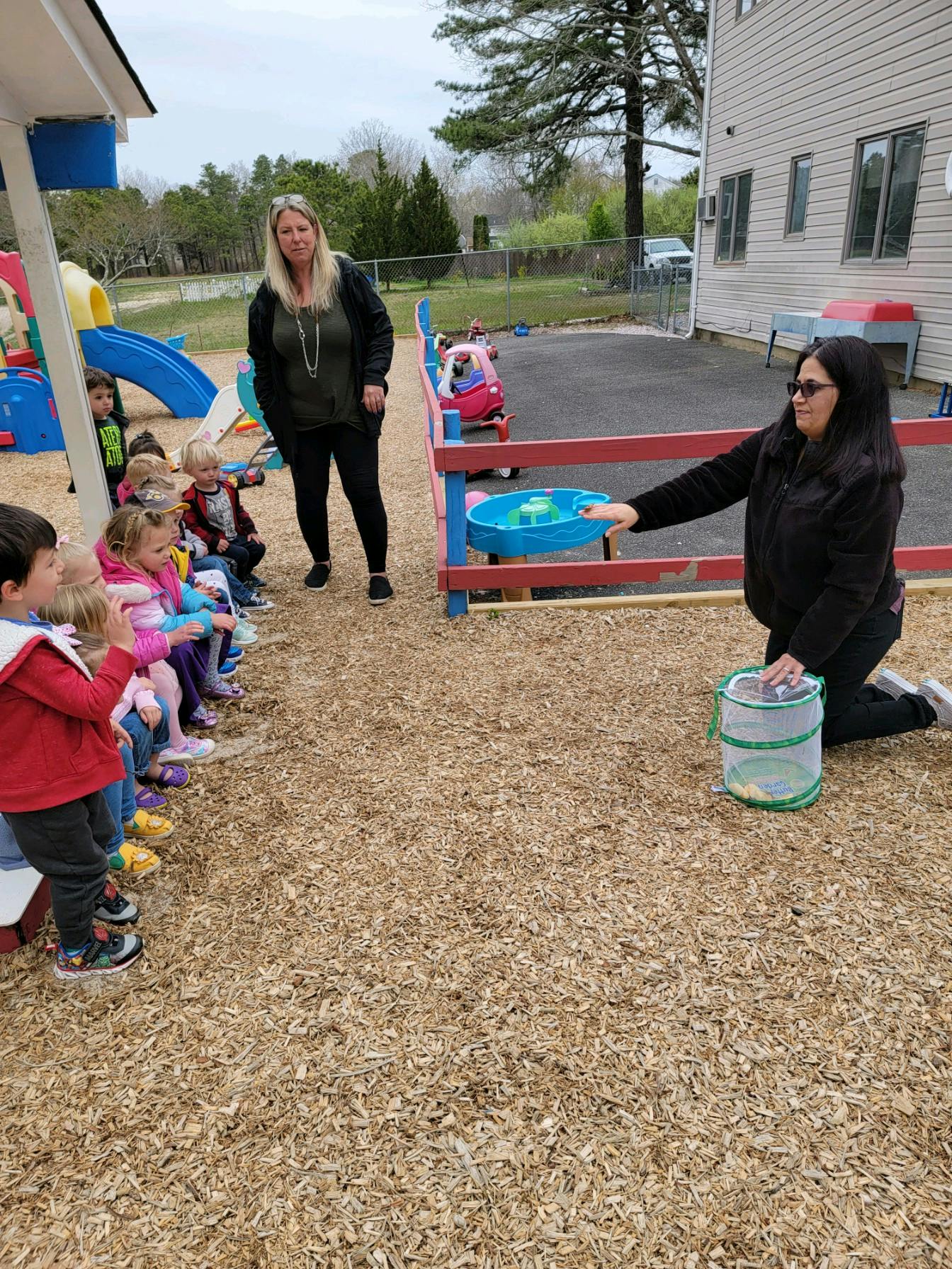 Adults and children on a playground