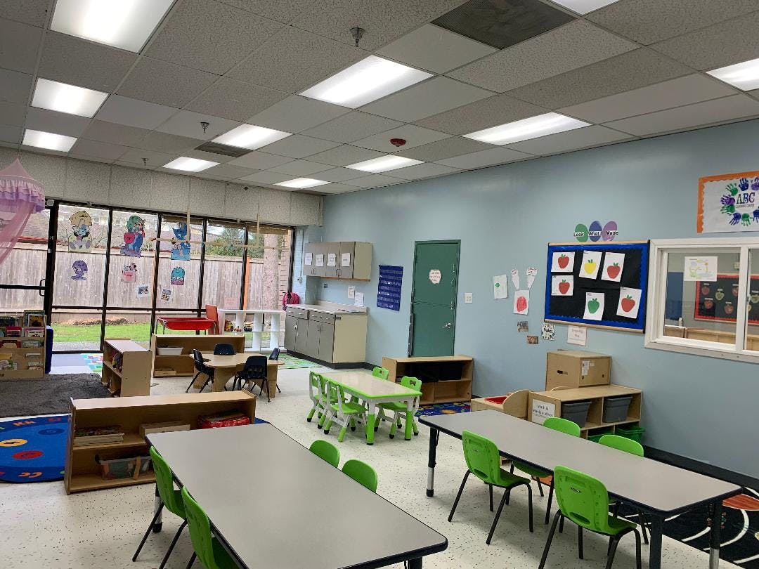 Empty classroom with small tables and chairs