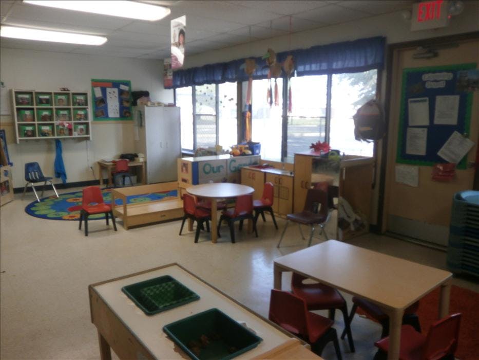 Empty classroom with small chairs and tables