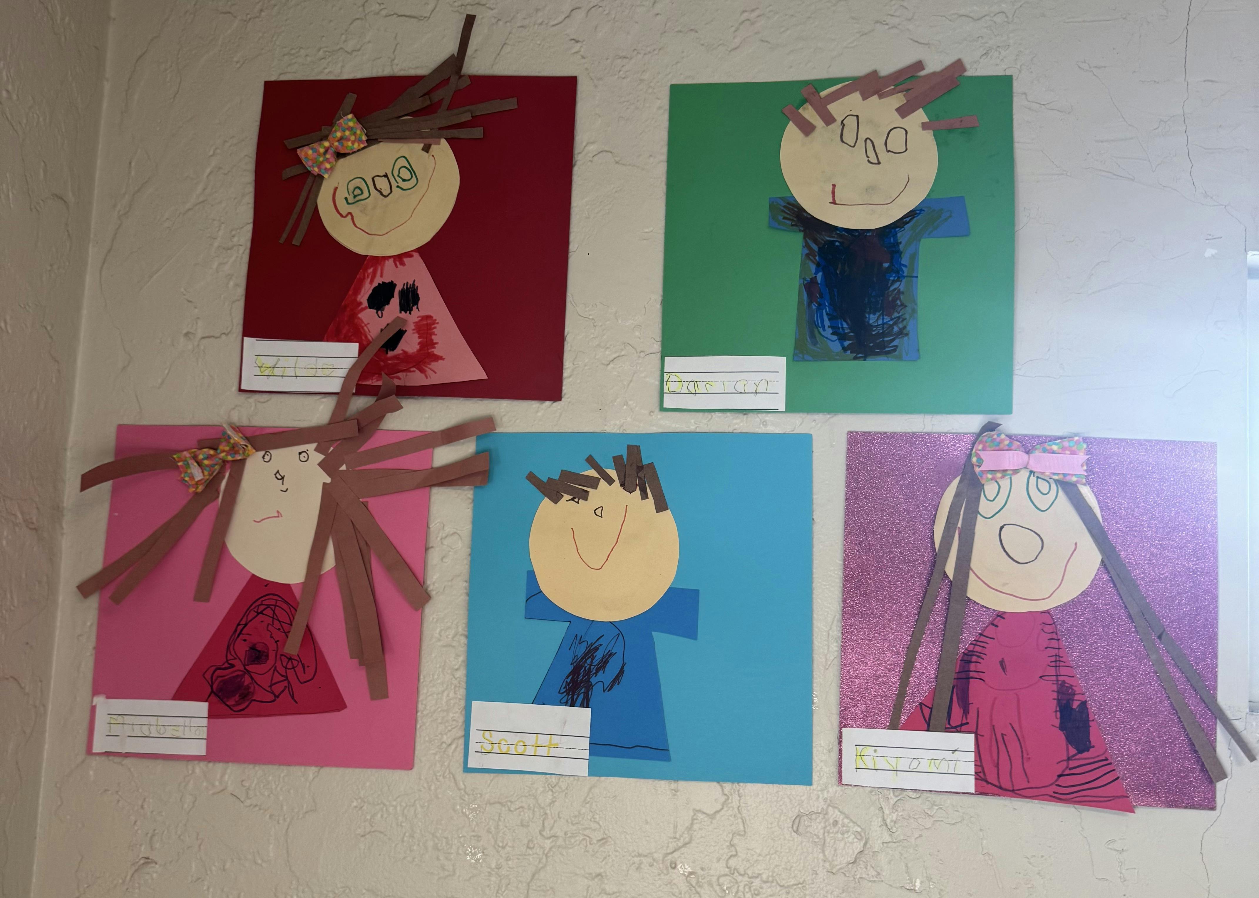 Five child-like paper cutouts with names underneath