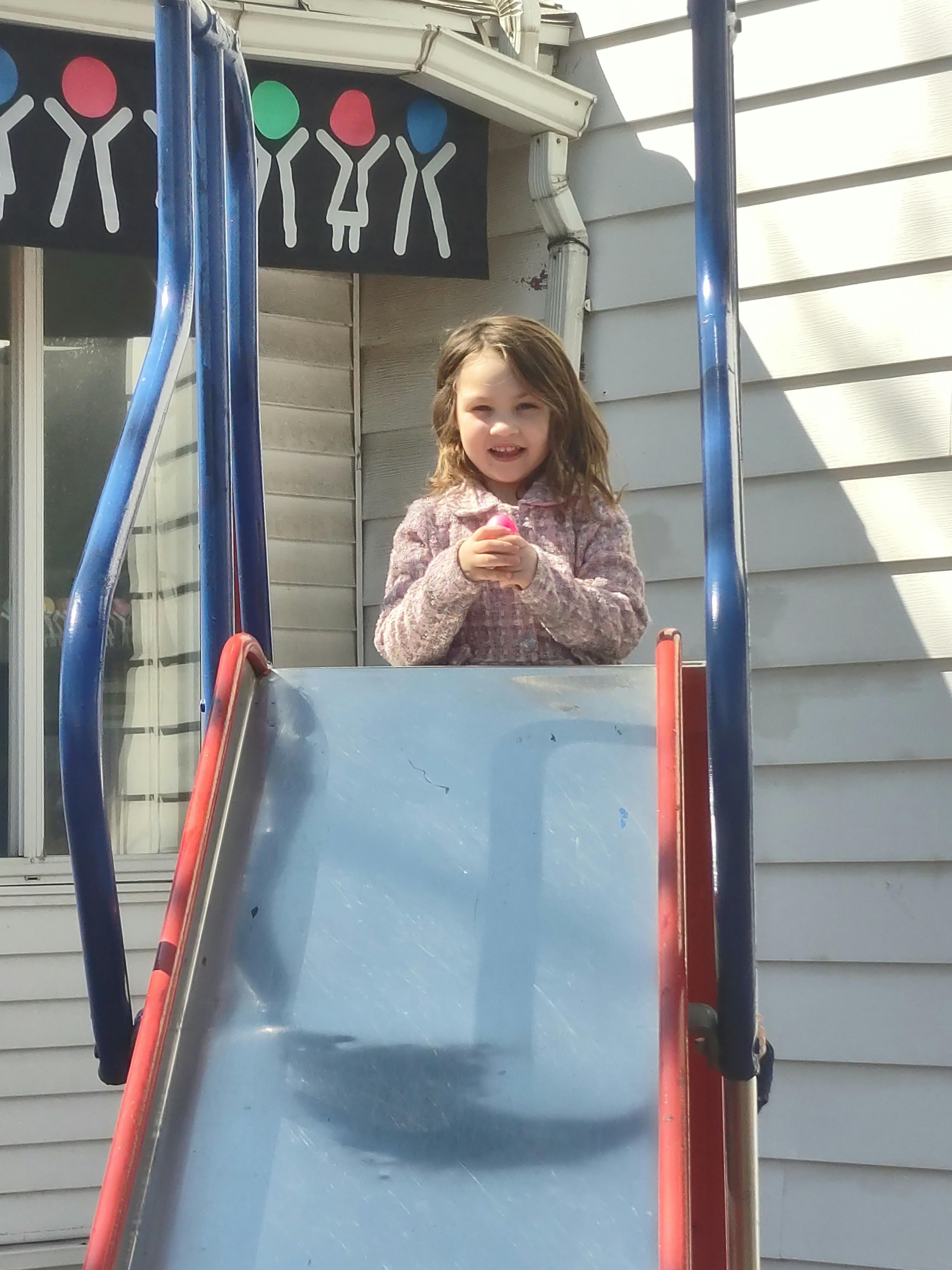 Child at the top of a slide