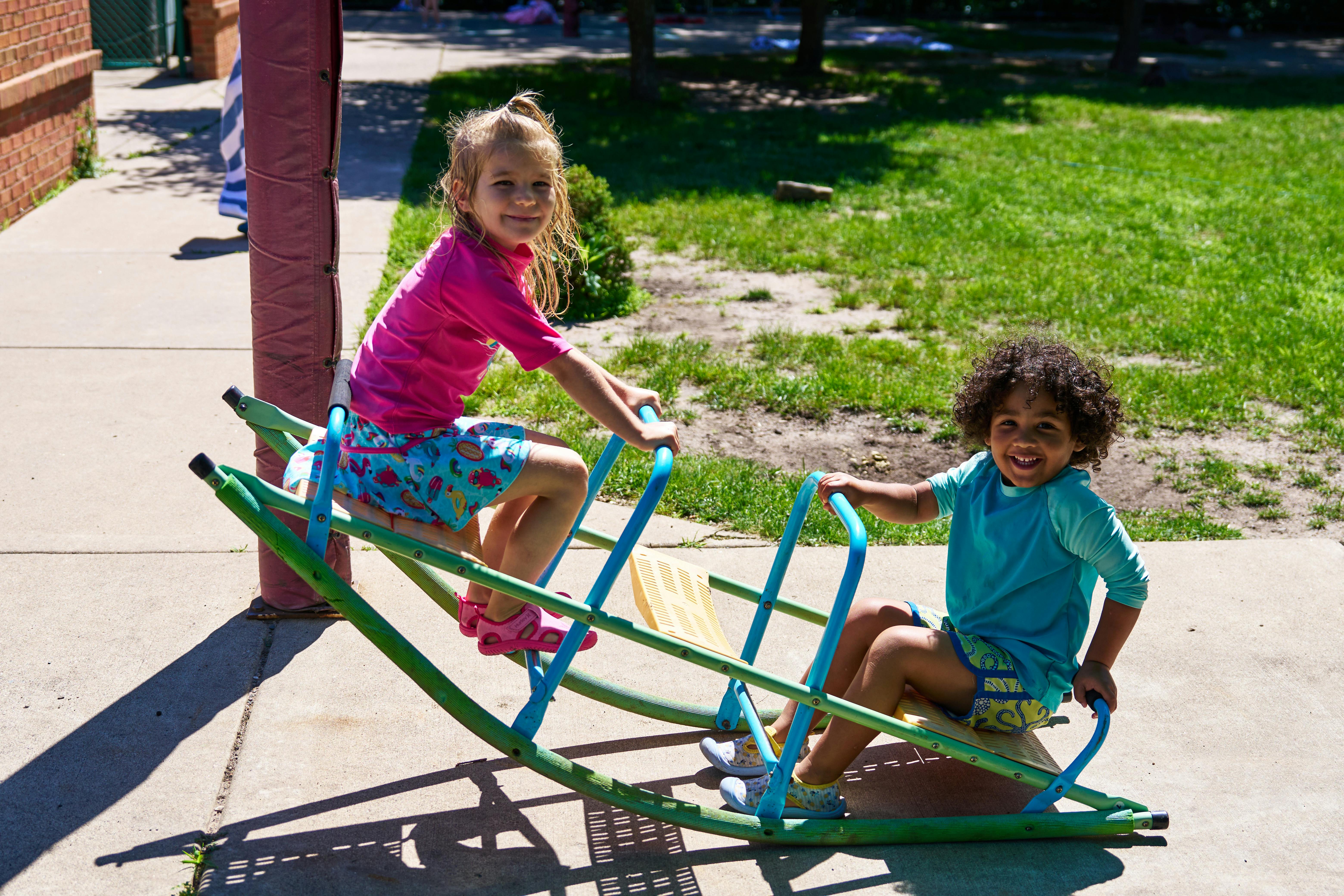 Two children on a seesaw