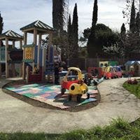 Playground with play structures and ride-on toys