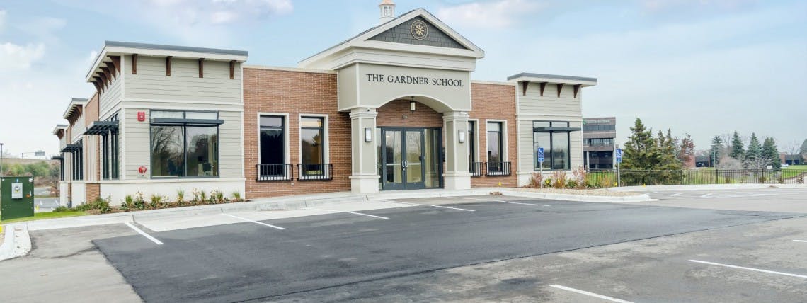 Building with "The Learning School" sign above the entrance