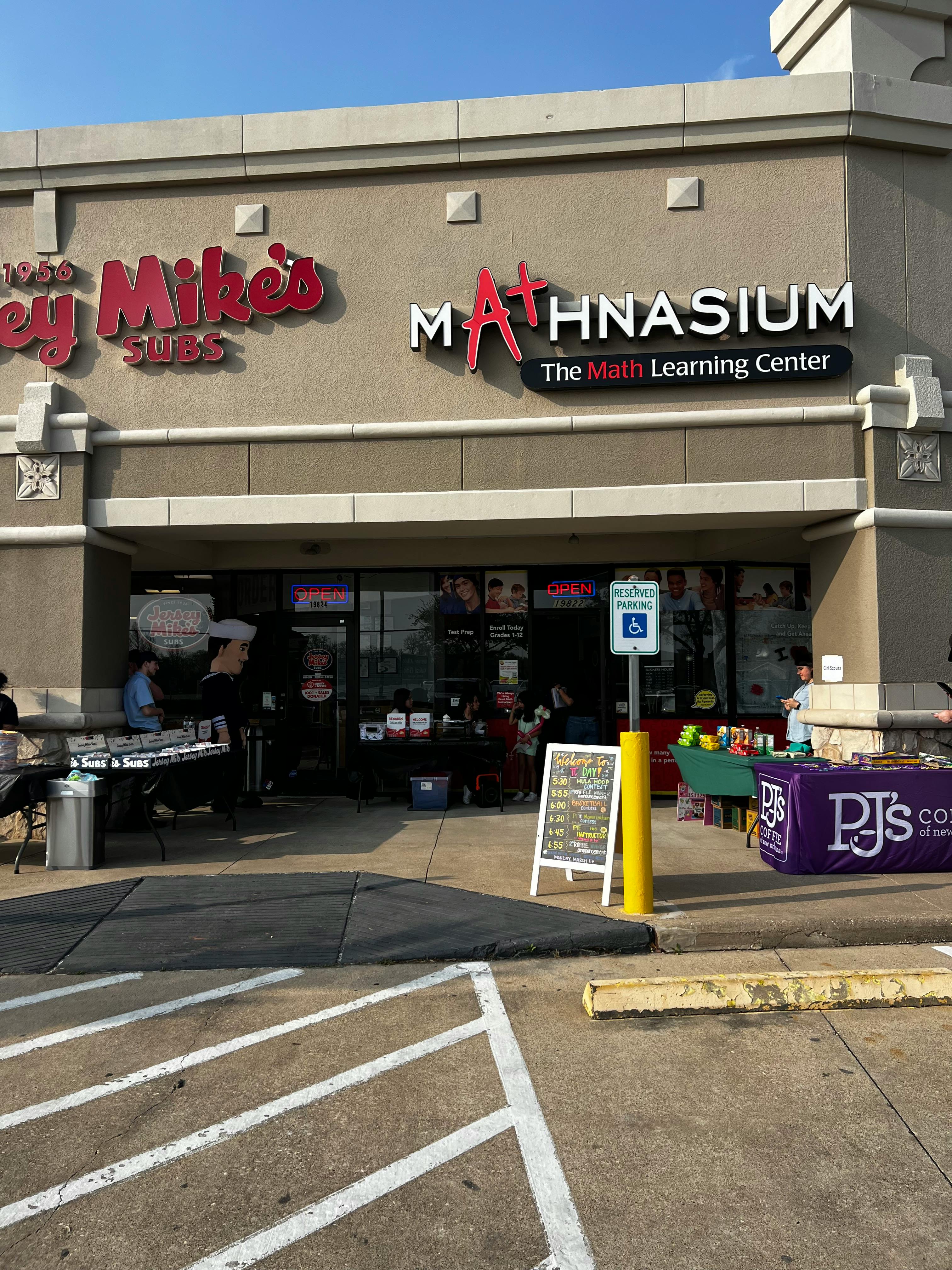 Storefront with signs for Jersey Mike's Subs and Mathnasium