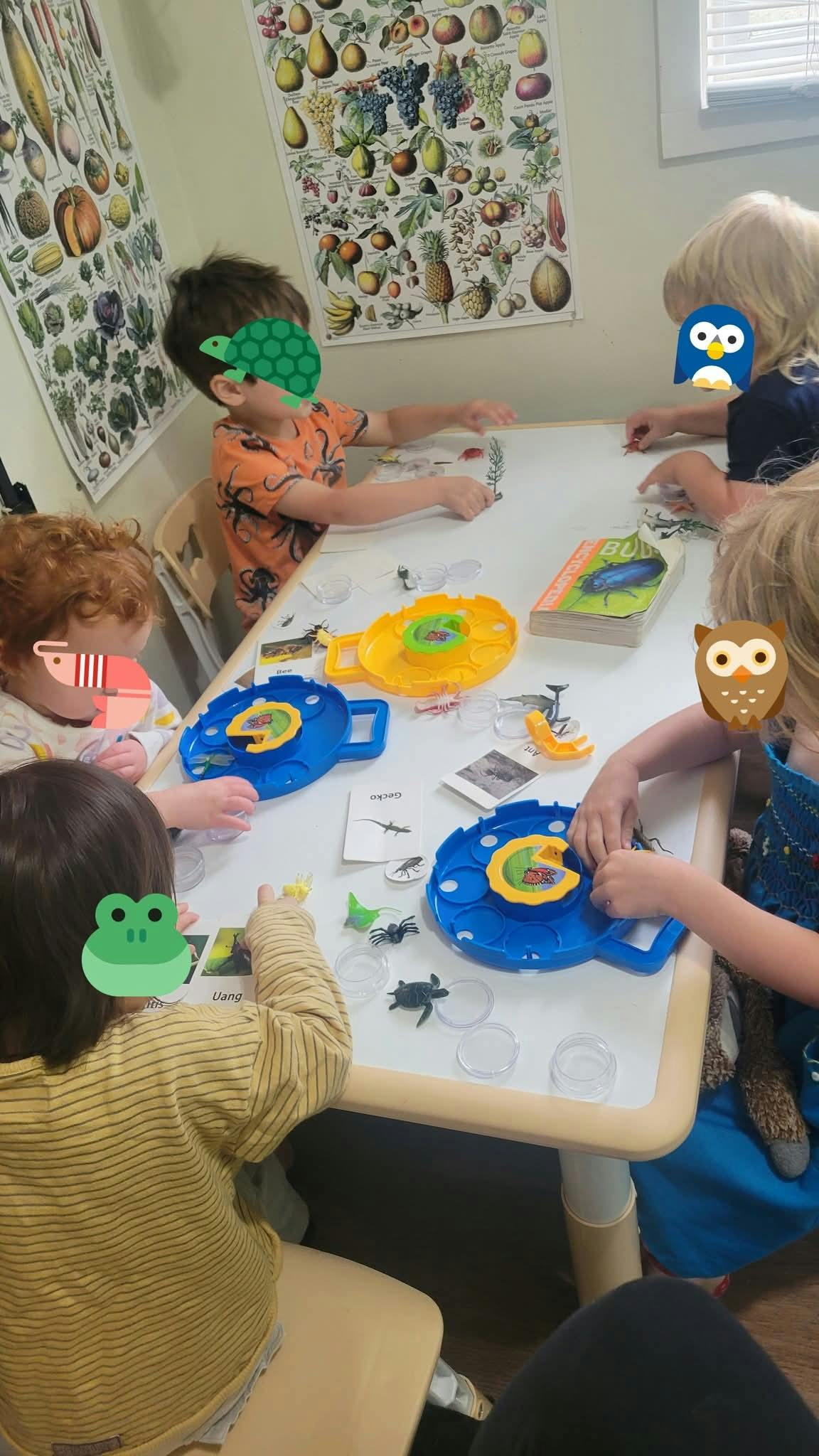 Children playing with toys at a table