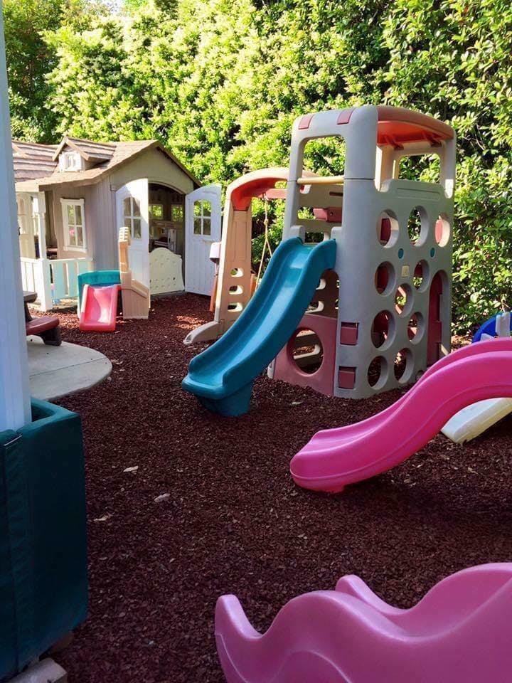 Playground with slides and a playhouse