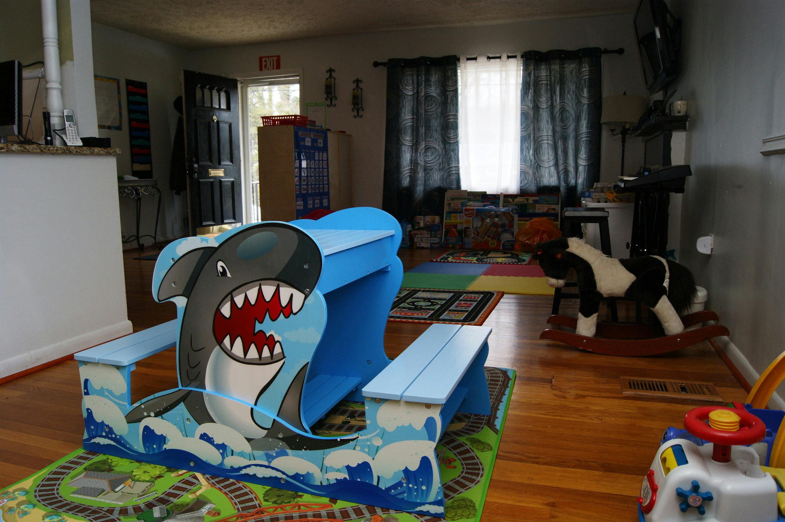 Blue child's desk and bench with a shark design