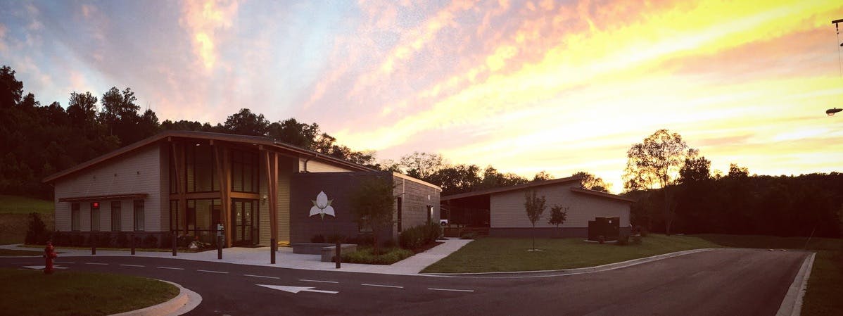 Modern building with large windows at sunset