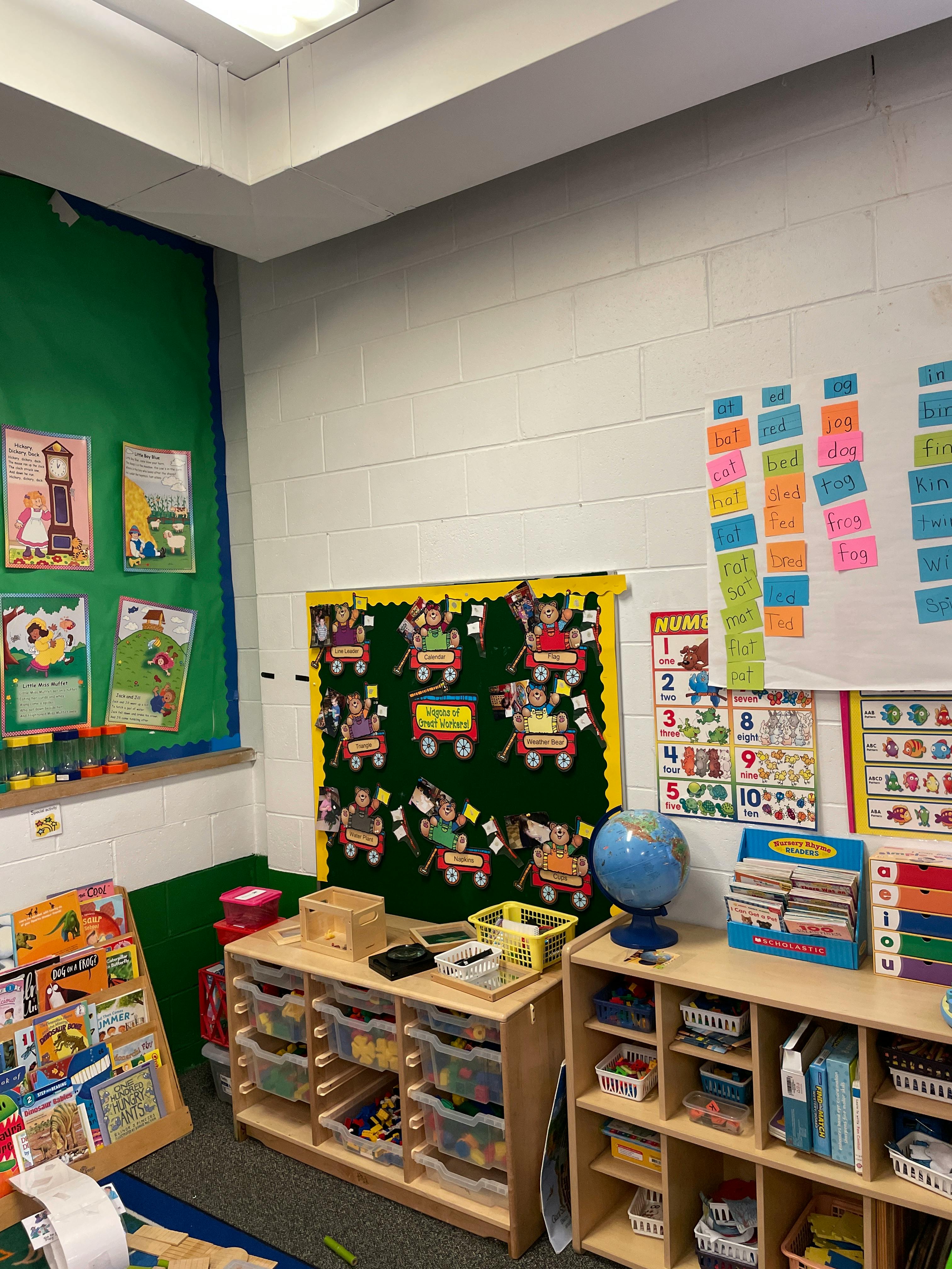 Classroom with bulletin boards, shelves, and learning materials