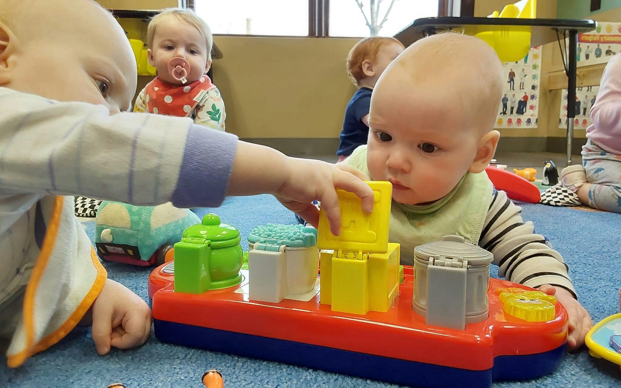 Two children playing with a toy