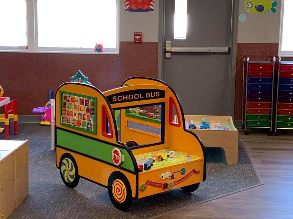 Toy school bus in a classroom