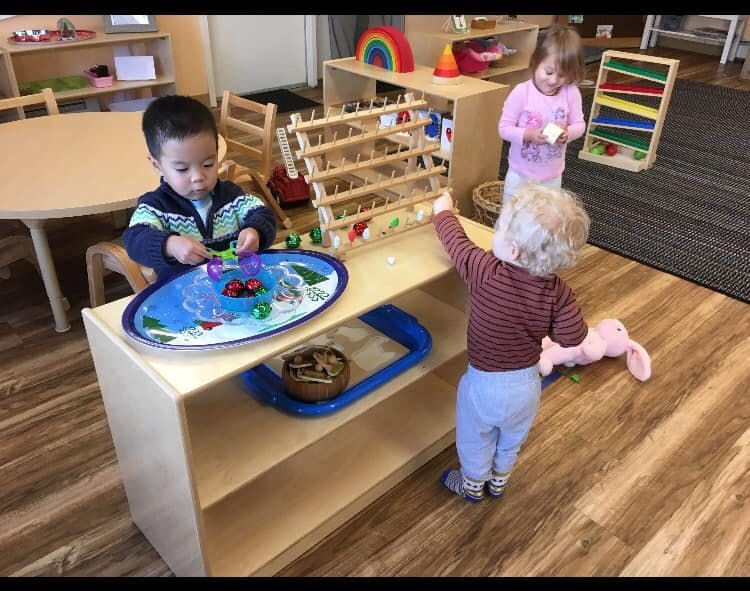 Children playing with toys in a classroom