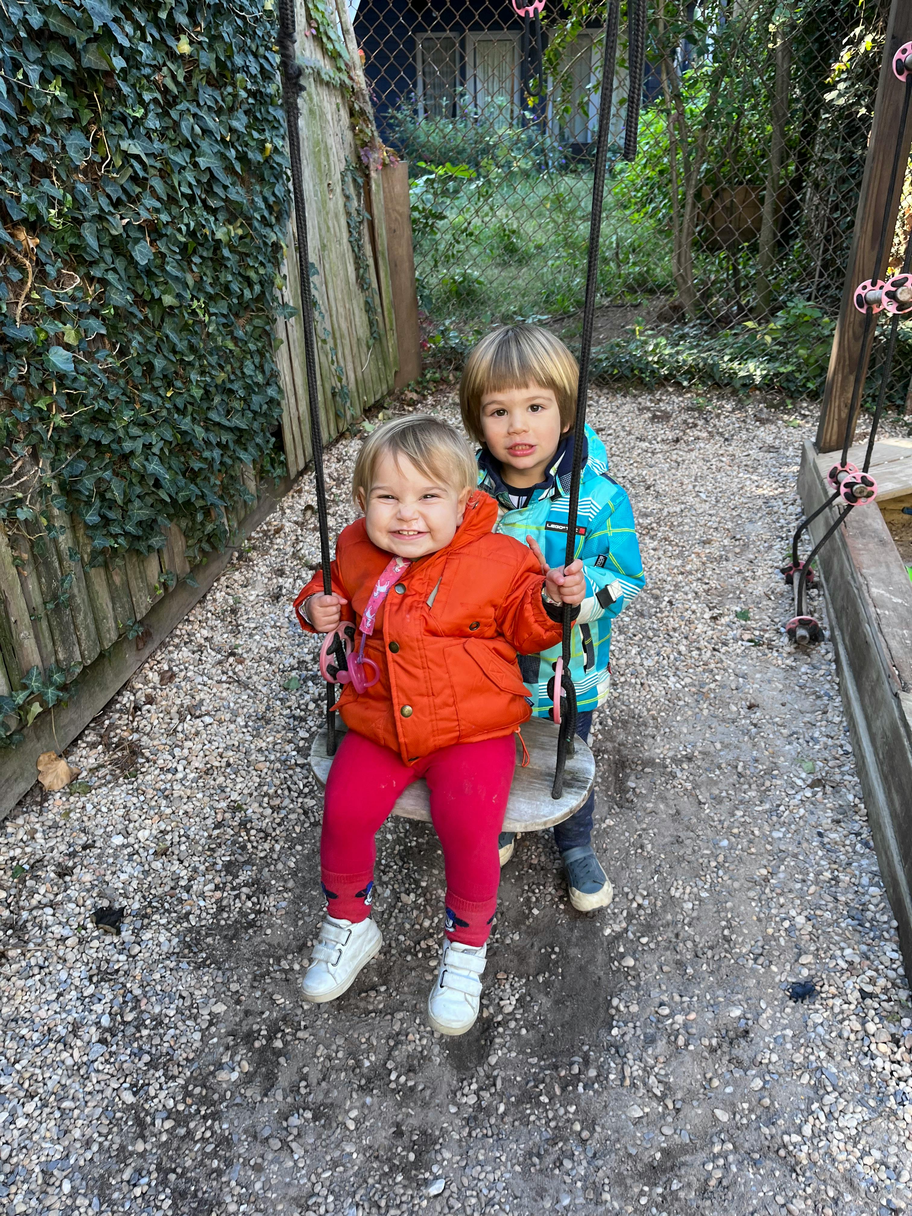 Two children on a swing