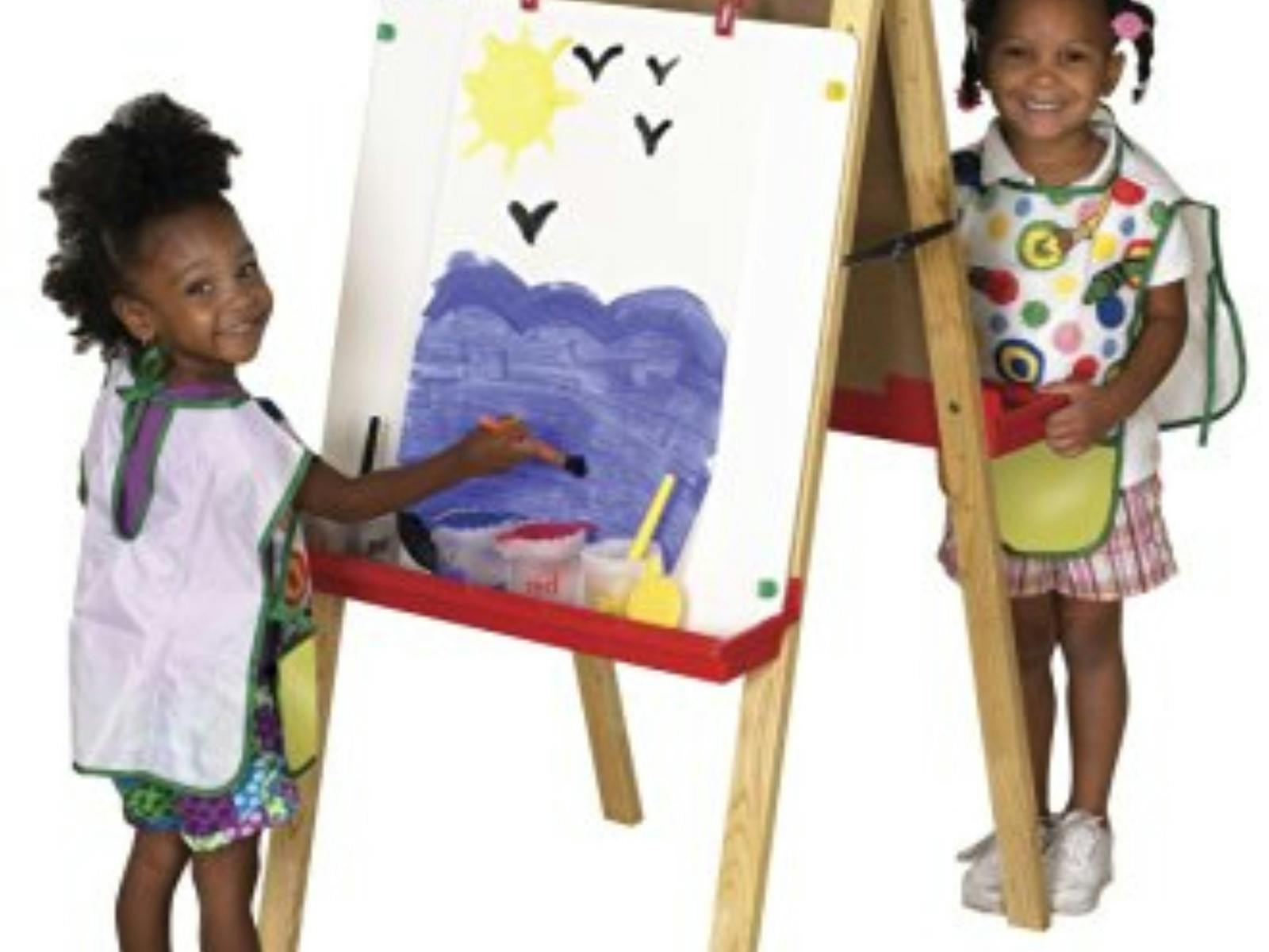 Two children painting at an easel