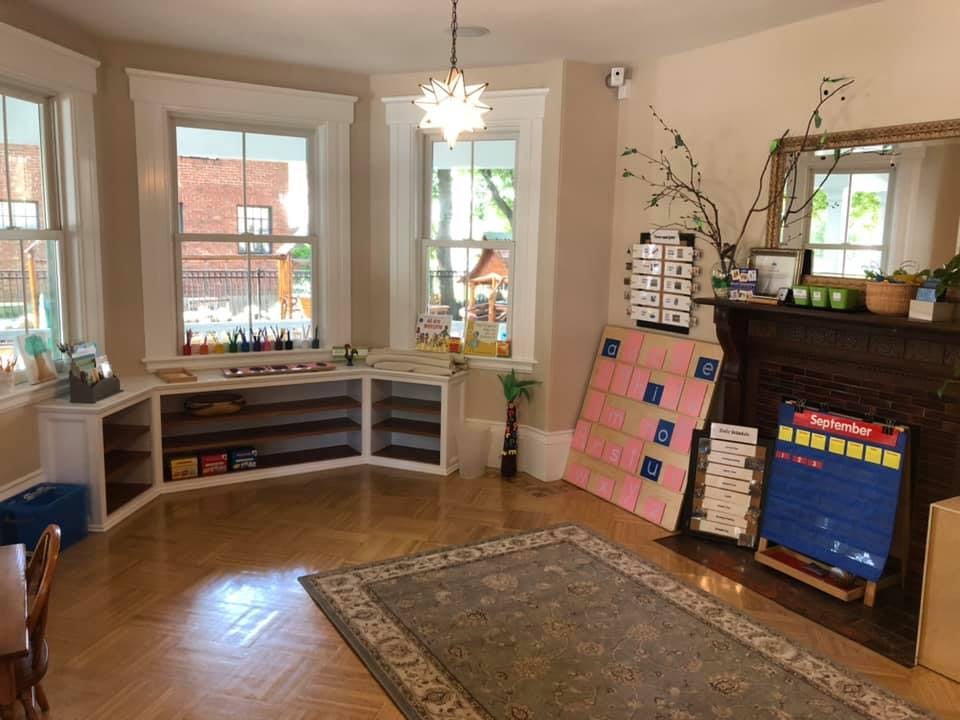 Classroom with windows, shelves, and learning materials