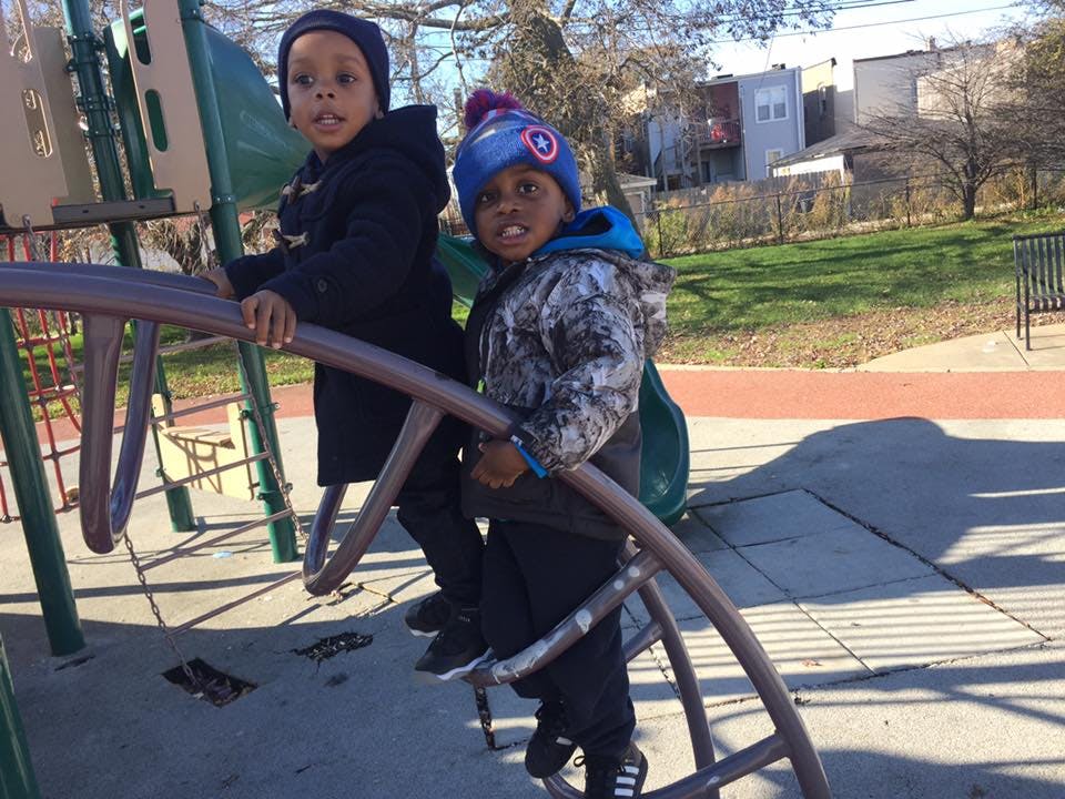 Two children on playground equipment