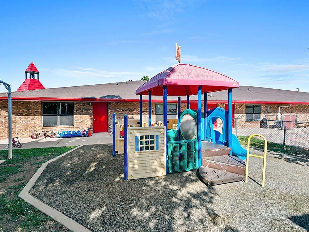 Outdoor children's playground with slides and steps