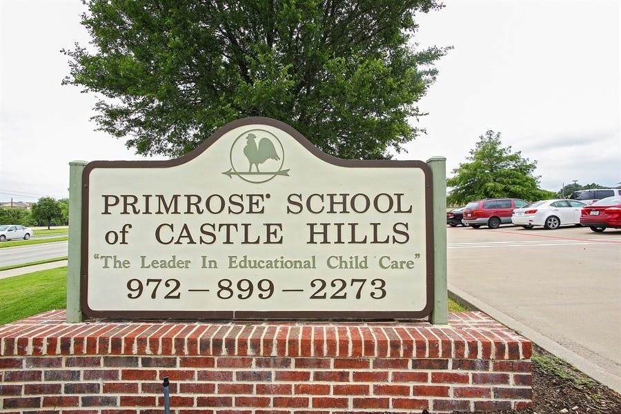 Primrose School of Castle Hills sign on a brick base