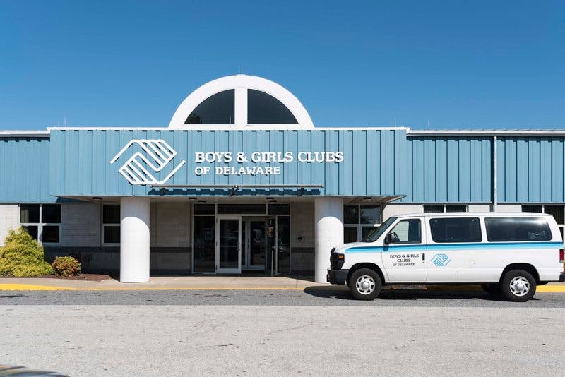 Boys & Girls Clubs of Delaware building with a white van parked in front