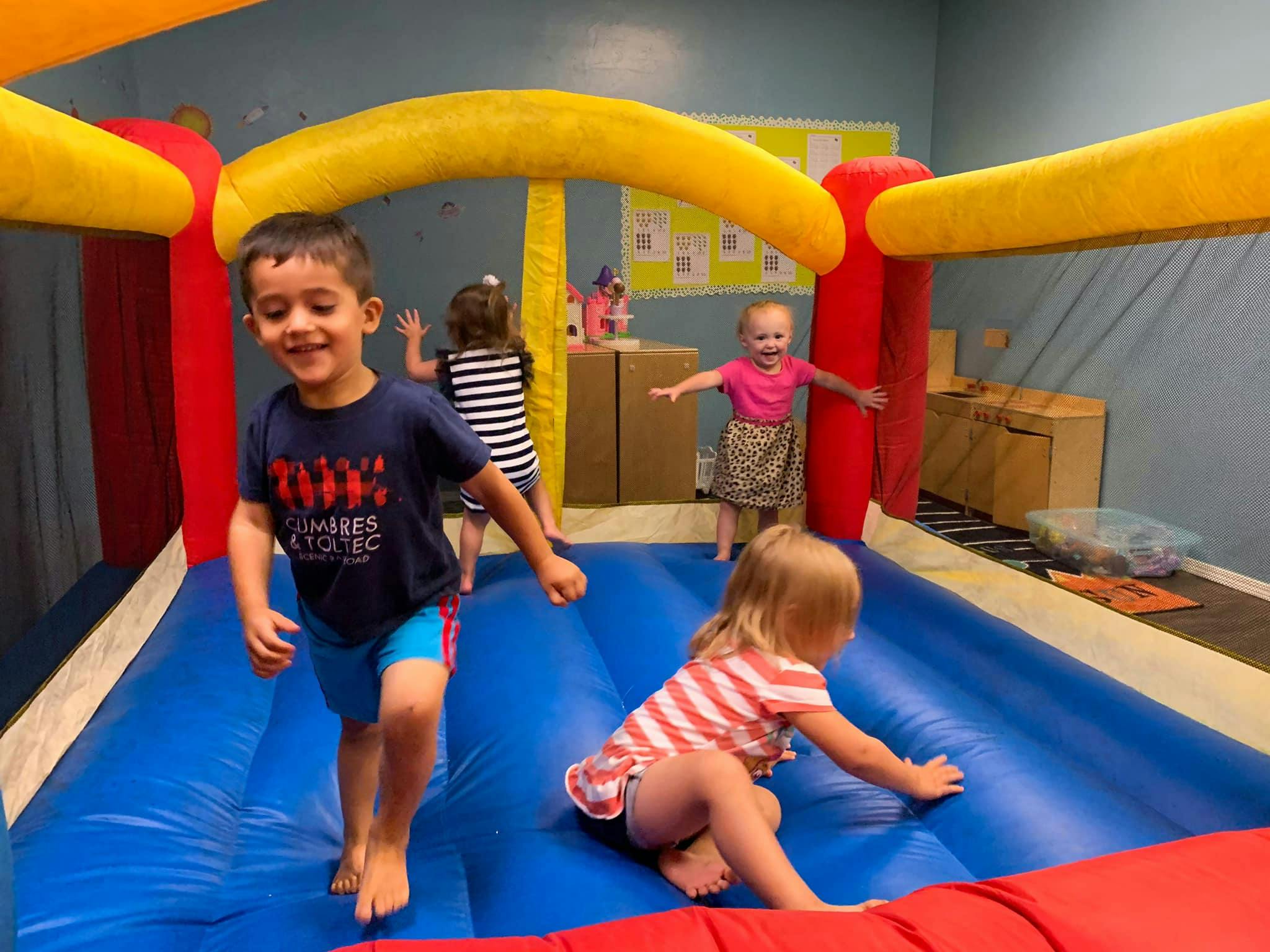 Children playing in an inflatable bounce house