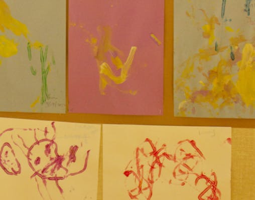 Multiple pieces of children's artwork displayed
