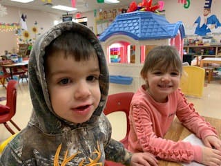 Two children in a classroom