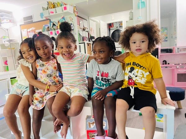 Five children sitting together