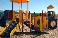 Playground structure with slides and climbing areas