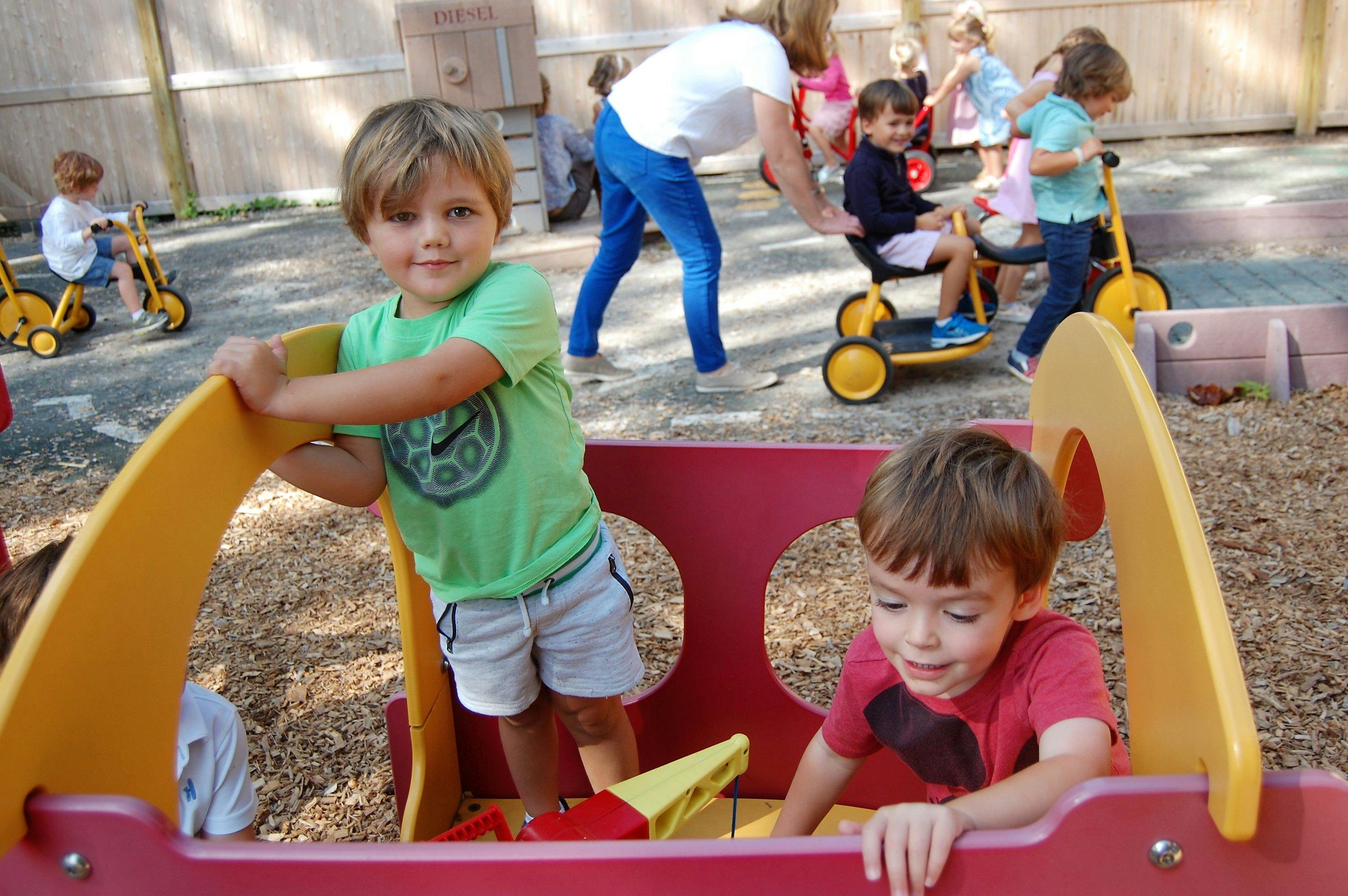Children playing on outdoor playground equipment
