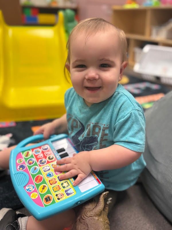 Child playing with a toy keyboard