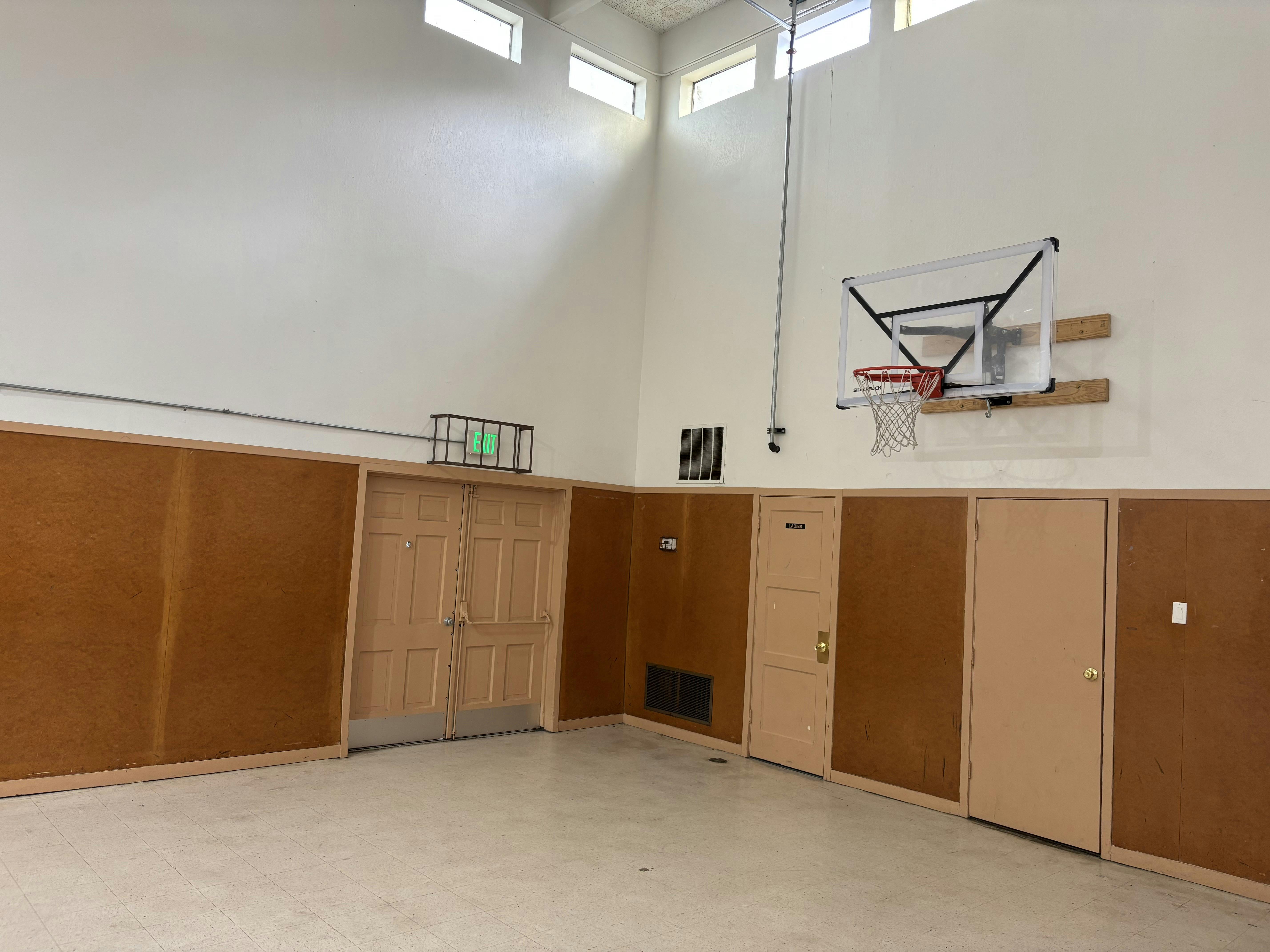 Indoor basketball hoop in a gymnasium