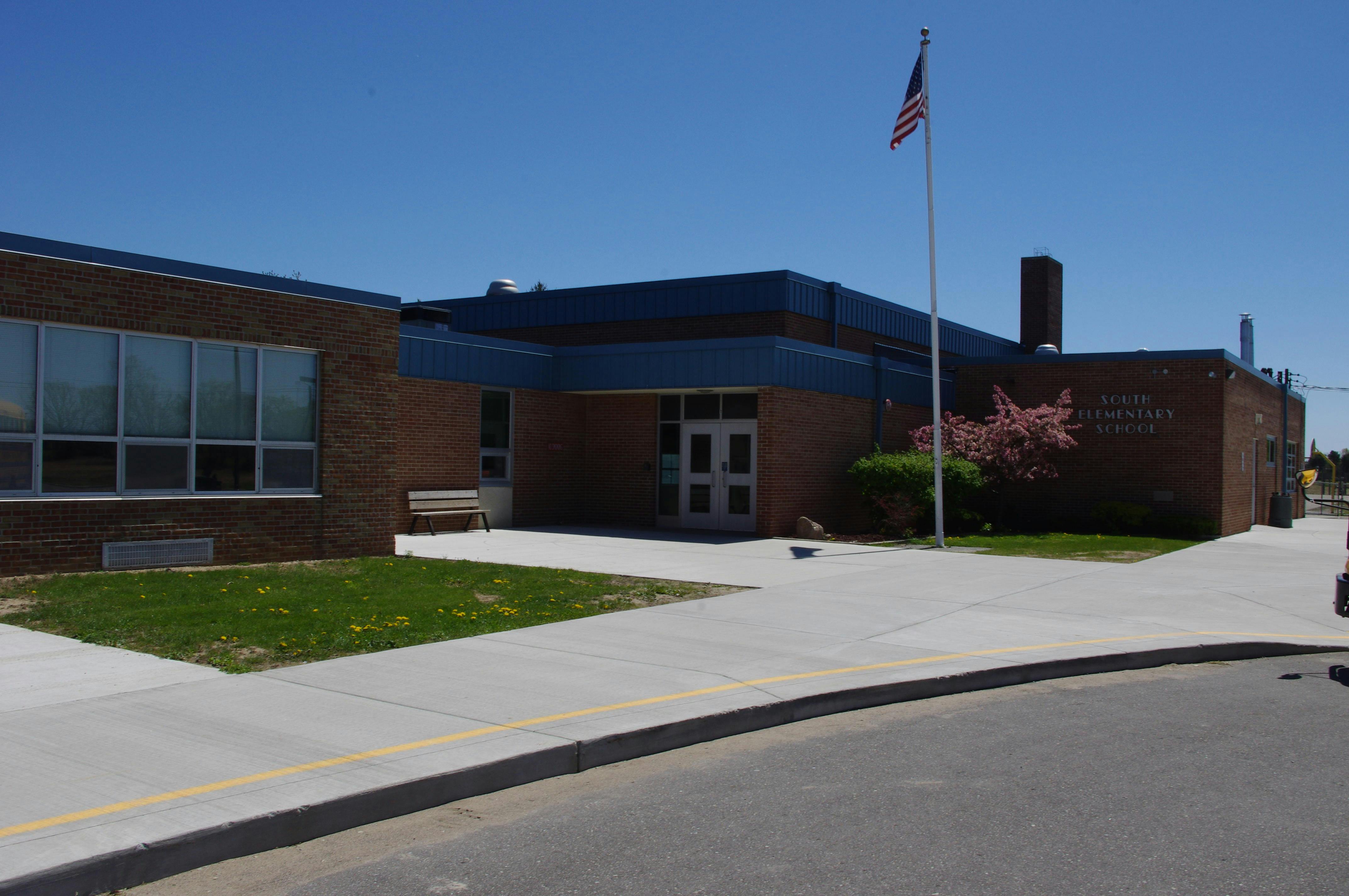 Brick building with an American flag on a flagpole