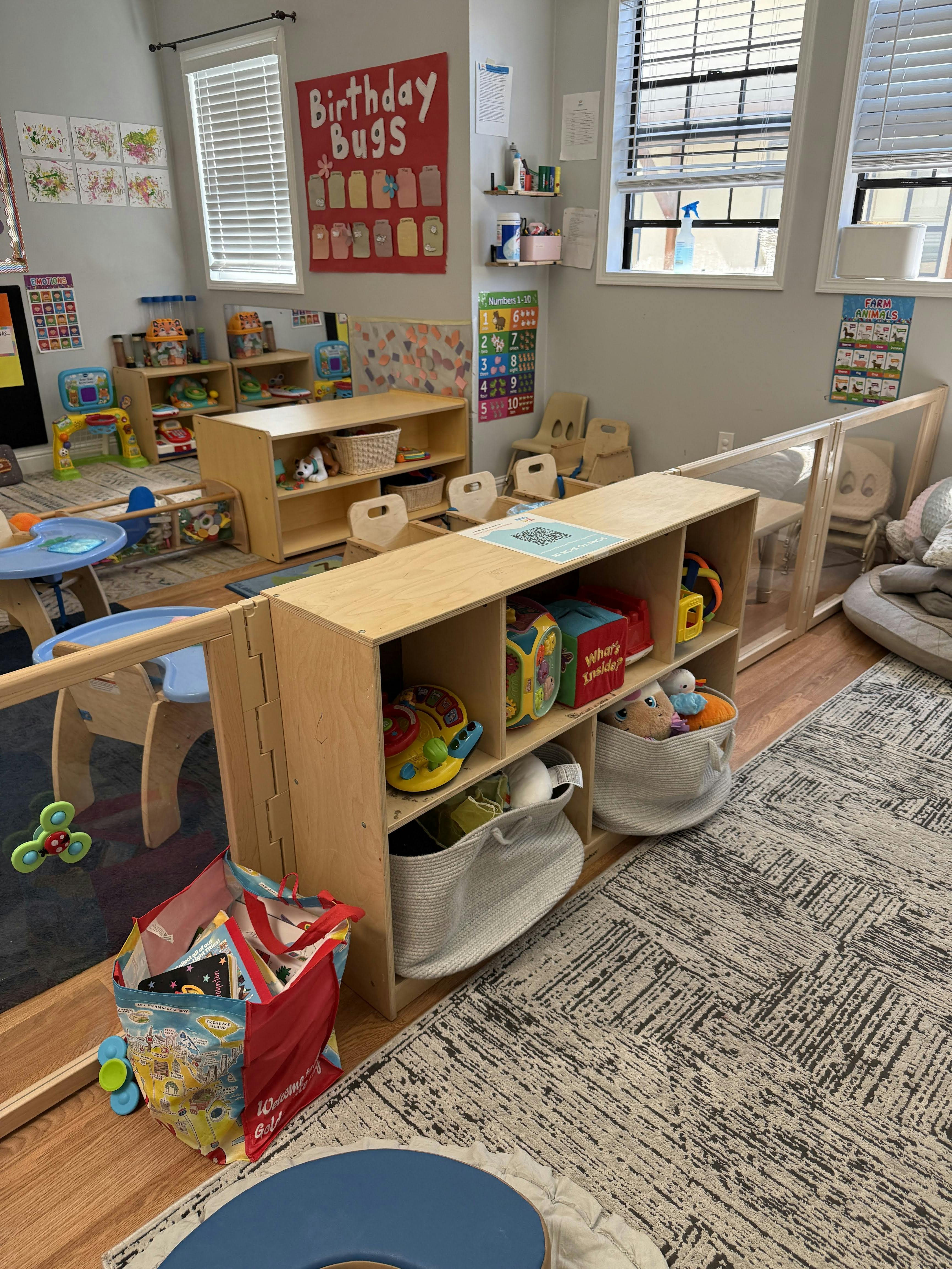 Classroom with shelves of toys and small tables