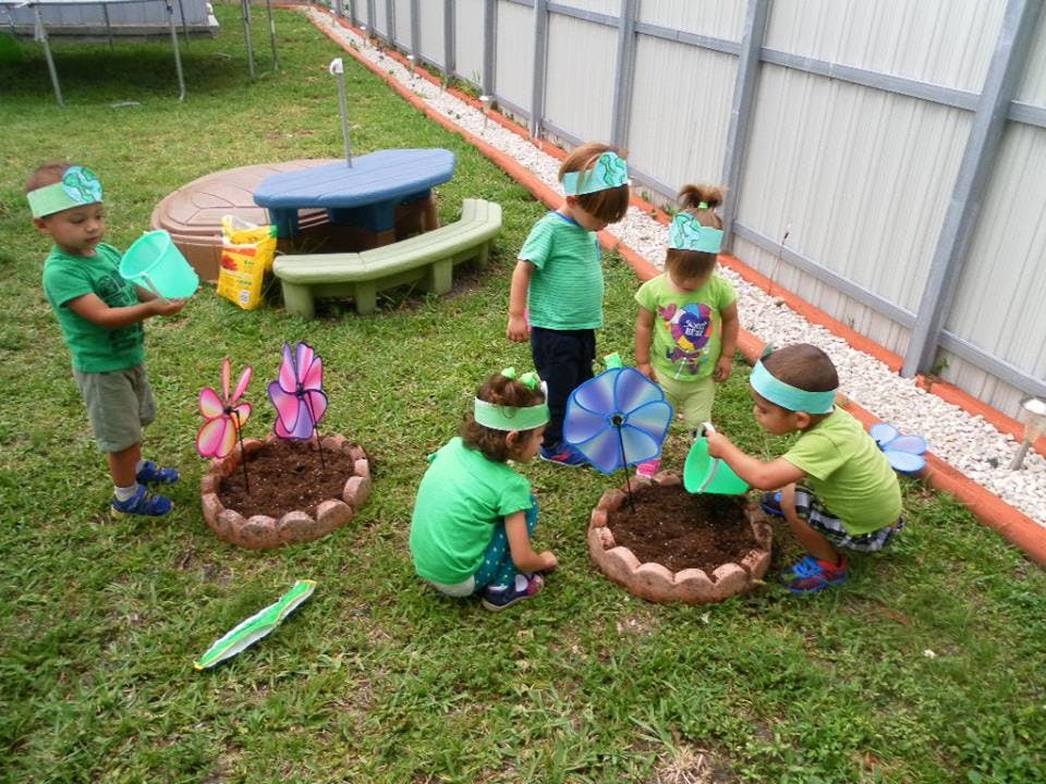Children planting in a garden