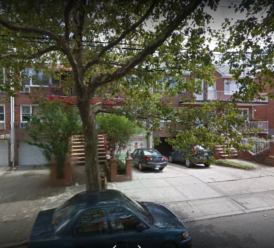 Residential building with cars parked in front