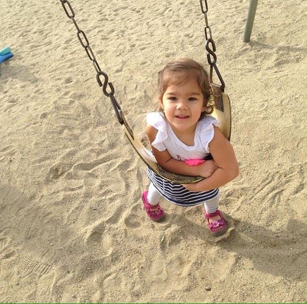 Child in a swing at a playground