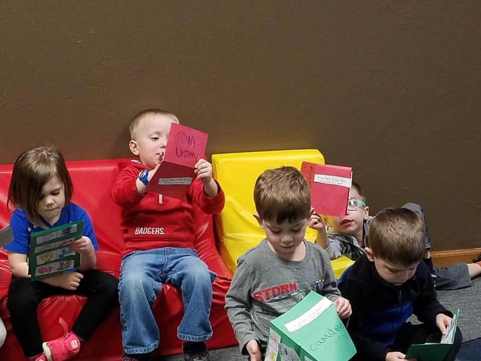 Children sitting and reading books
