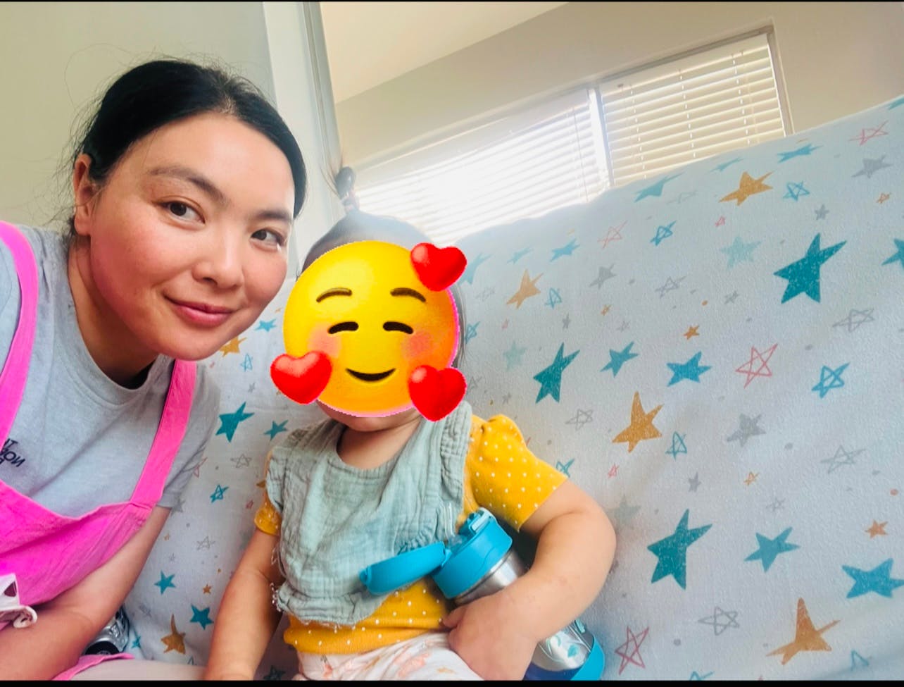 Person and child with emoji over face