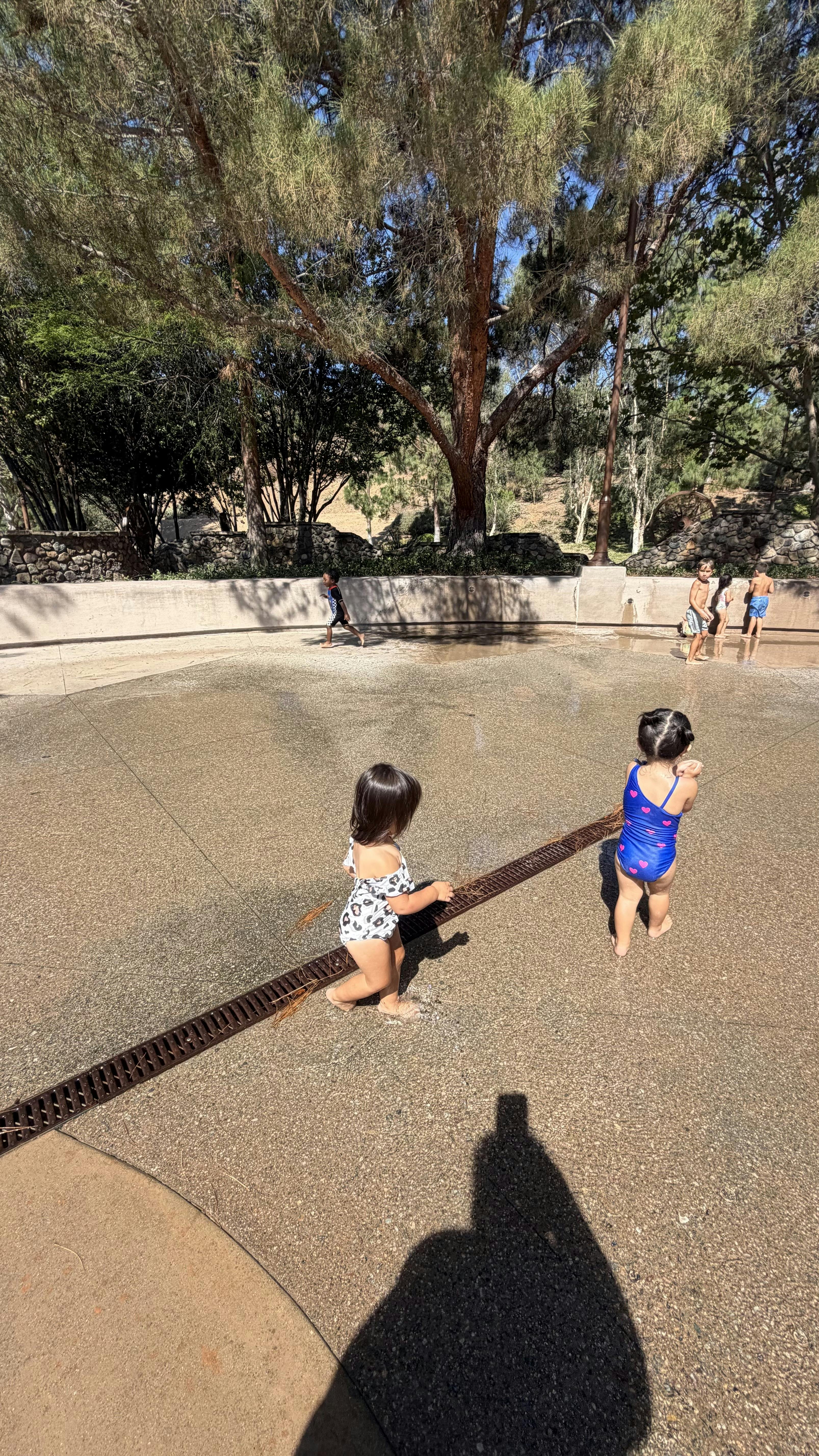 Children playing in a splash pad area