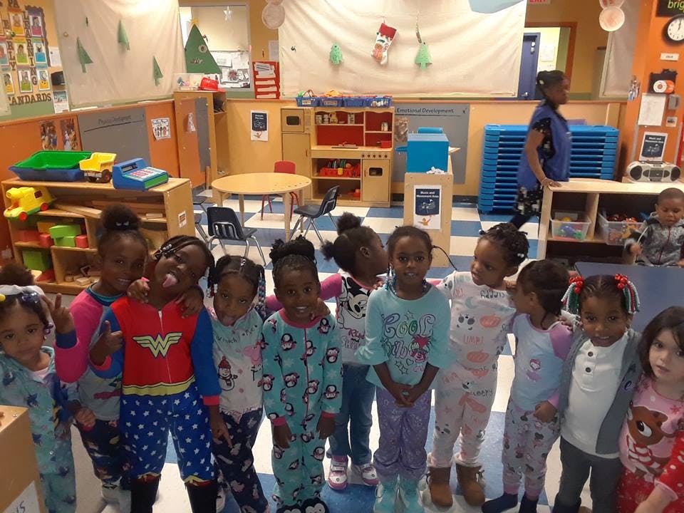 Group of children in pajamas in a classroom