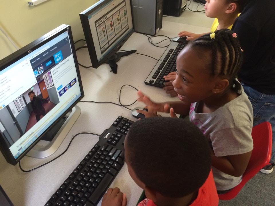 Children using computers in a classroom
