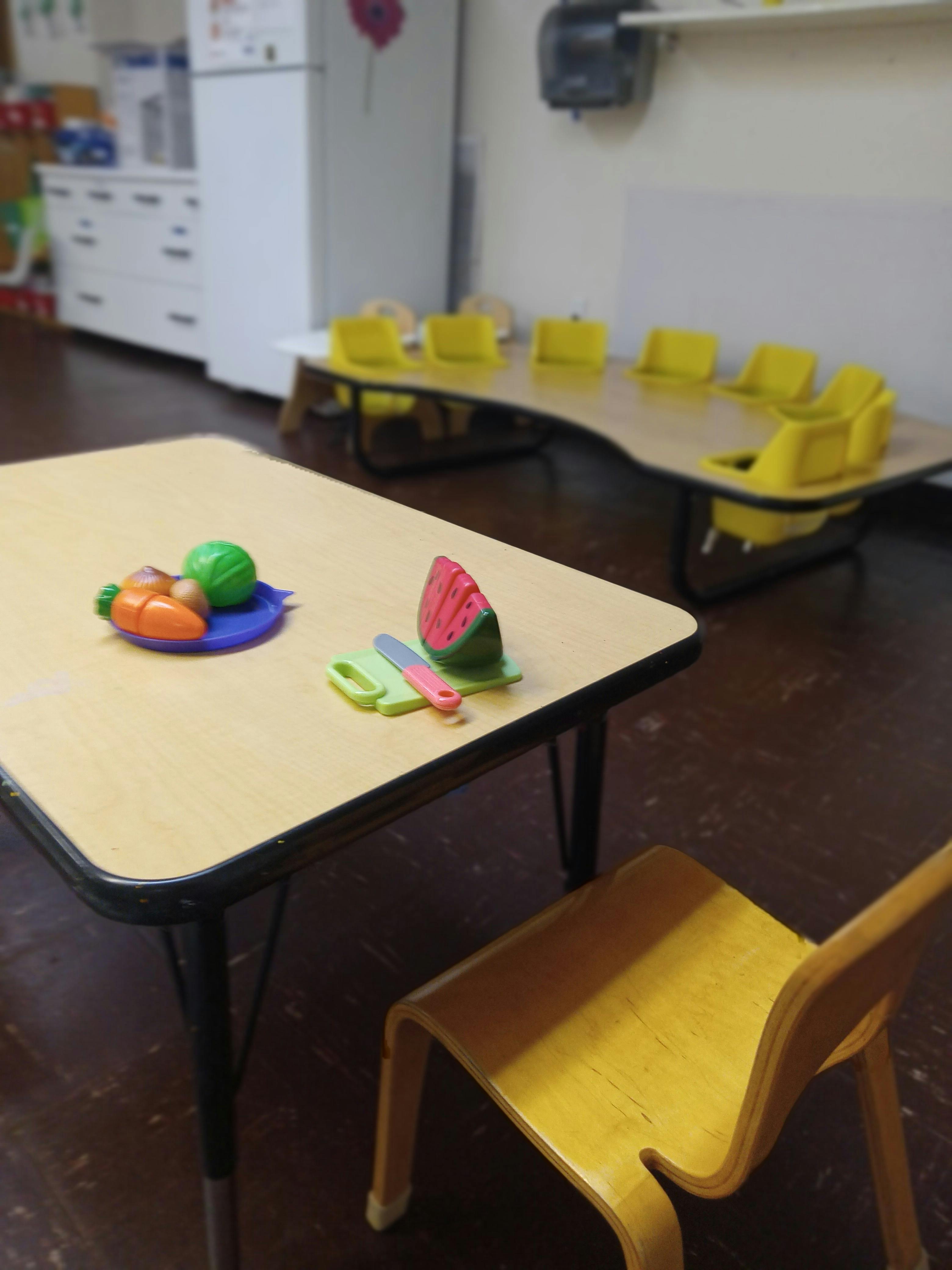 Play food on a small table in a classroom