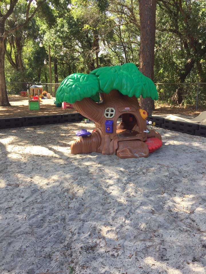 Treehouse play structure in a sandbox