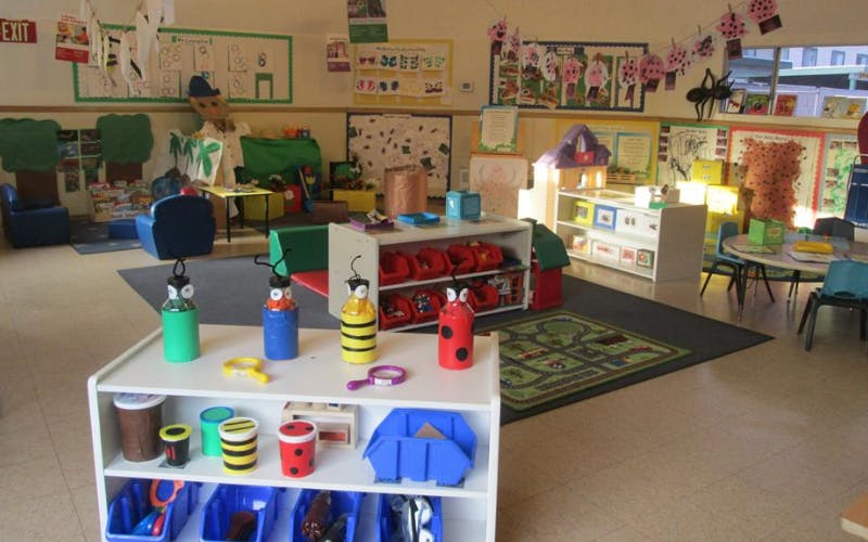 Classroom filled with colorful children's furniture and decorations