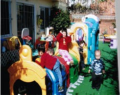 Children playing on outdoor playground equipment