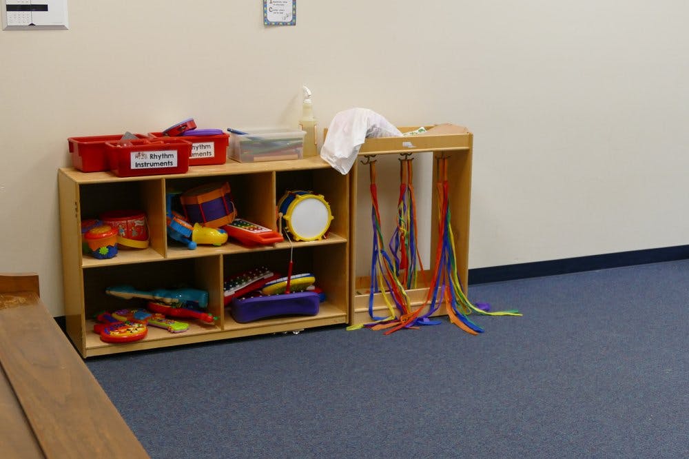 Shelves with musical instruments and colorful ribbons